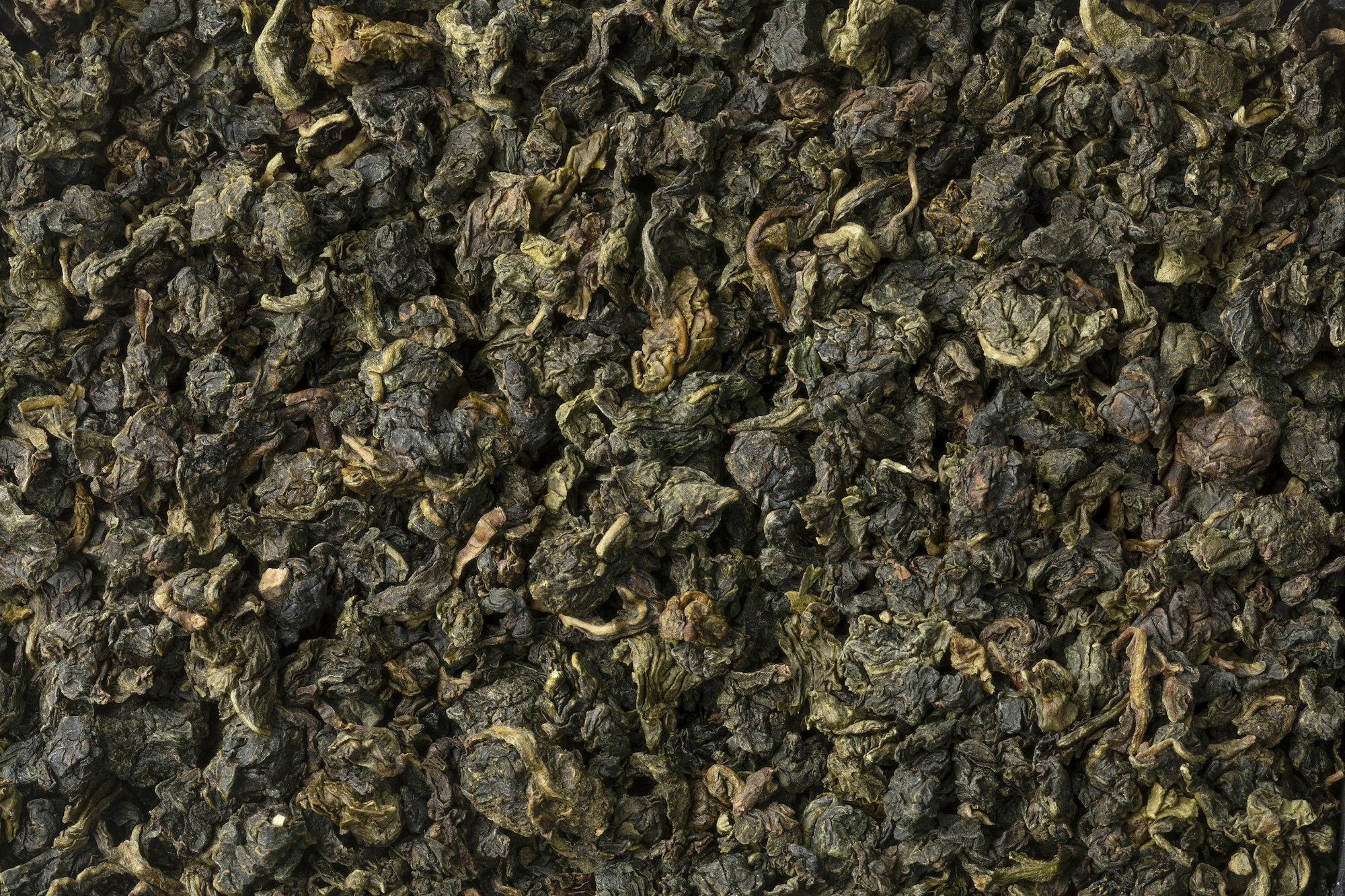 Chinese Ti Kuan Yin dried tea leaves full frame close up